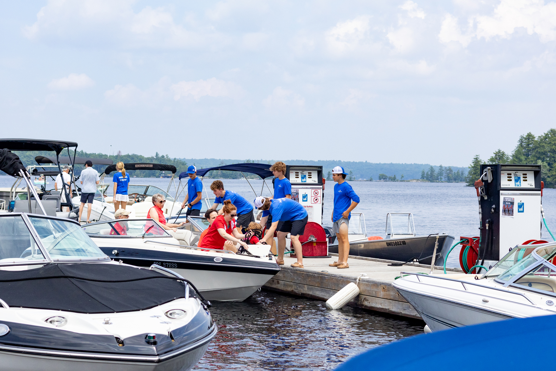 Staff on dock fueling boat